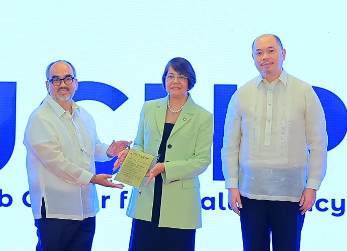 President of Unilab Foundation, presented the plaque of appreciation to Asec. Gorgolon, with Mariano John Tan (right), Vice President of Unilab Foundation, during the launch of the Unilab Center for Health Policy (UCHP).